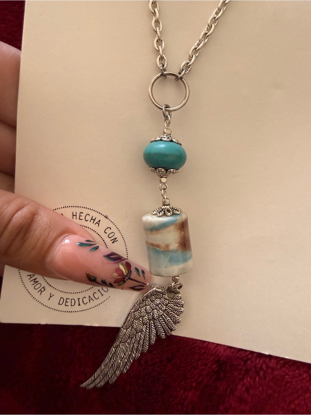 Silver Wing Pendant Necklace with Turquoise and Cream Beads